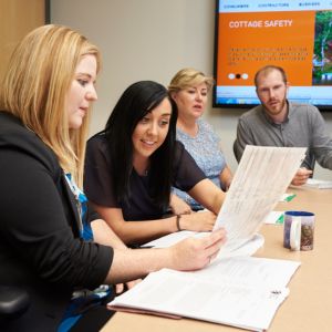 four people sitting at a table