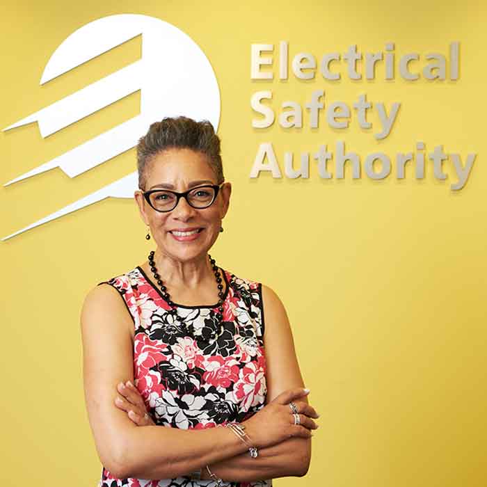 woman smiling in front of ESA logo