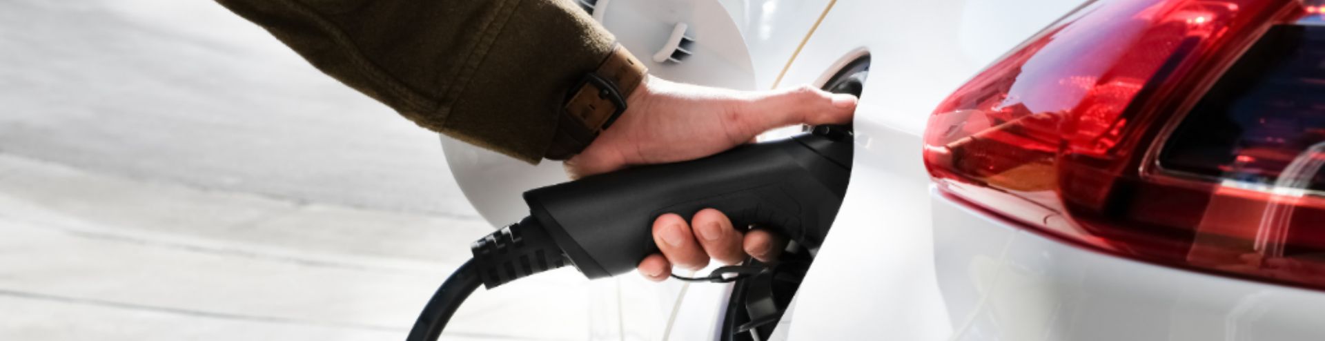 hand on ev charger
