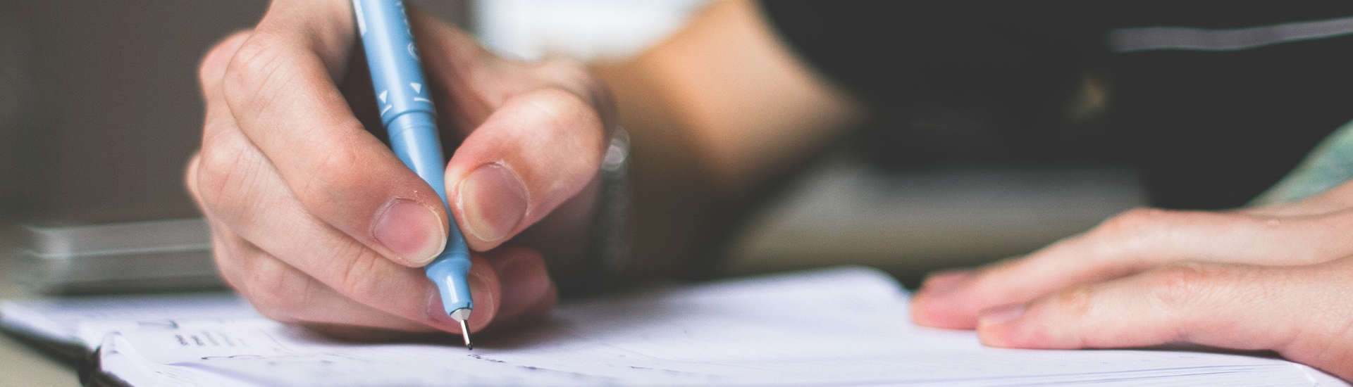 pen writing on paper
