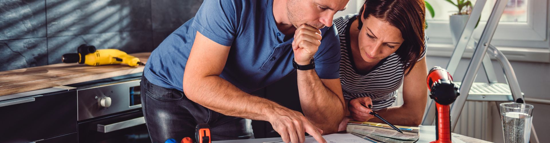 man and woman reviewing plans