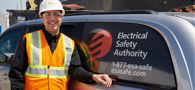 ESA inspector standing by van