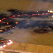 wood burning on a table top