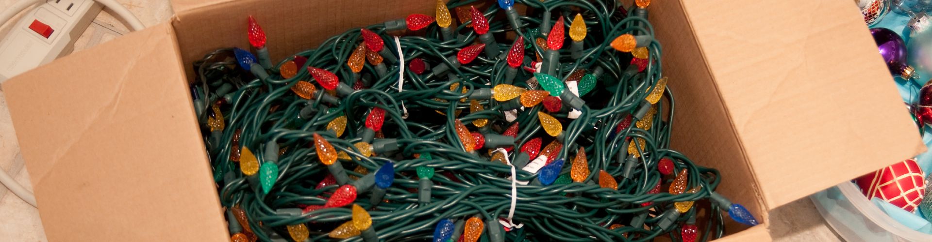 holiday lights in a cardboard box