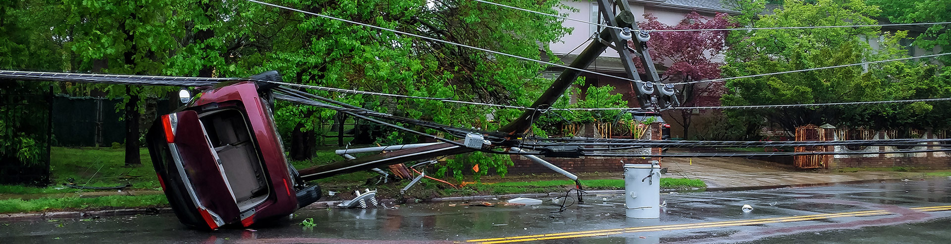 red car under a downed powerline